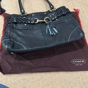 Authentic Beautiful black grained leather coach tote rope detail.